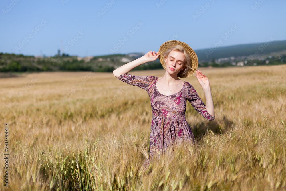 fashionable woman farmer in field of wheat harvesting rye fashionable woman farmer in field of wheat harvesting rye