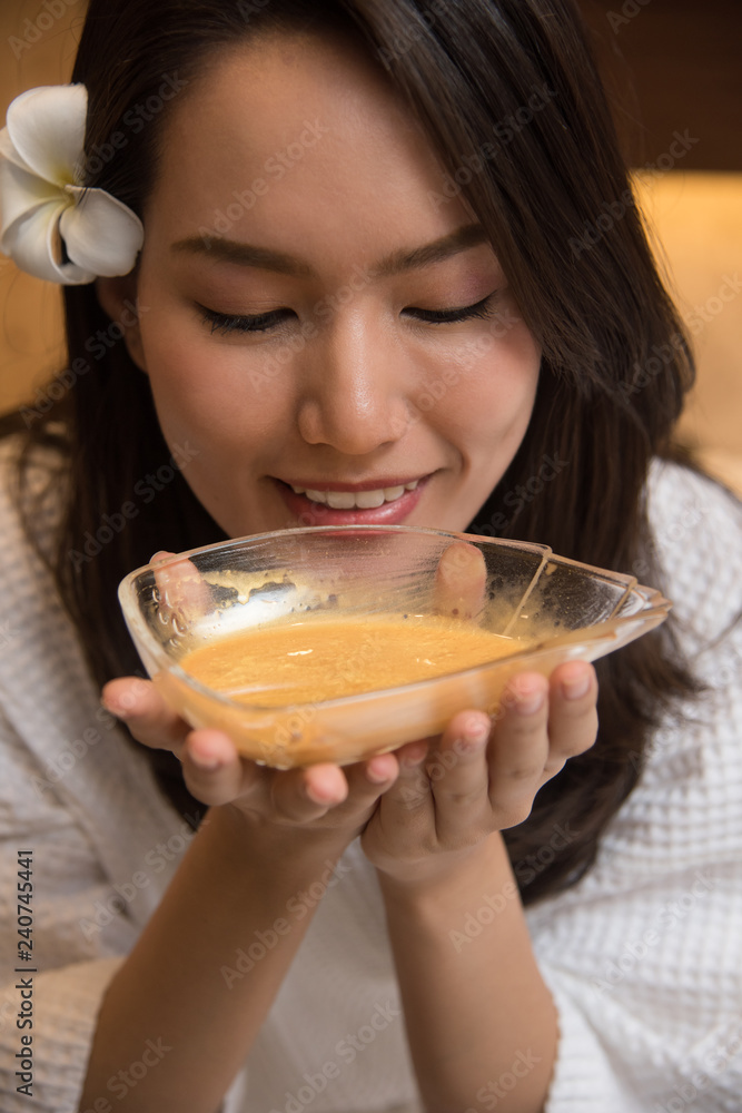 asia woman spa with Golden Mask Cream massage for face