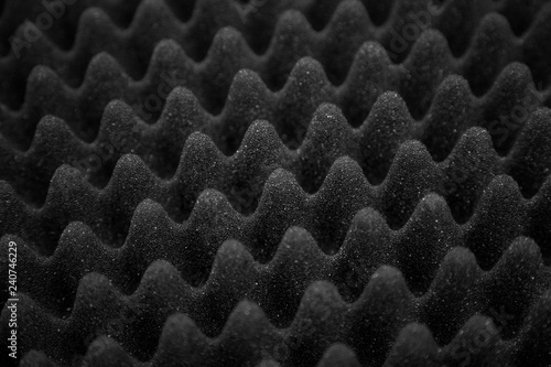 Texture soundproof panel of polyurethane foam. Abstract black rubber foam background.