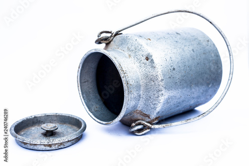 Close up of sliver colored milk chum or milkcan isolated on white used to store or transport milk or other edible liquids isolated on white.