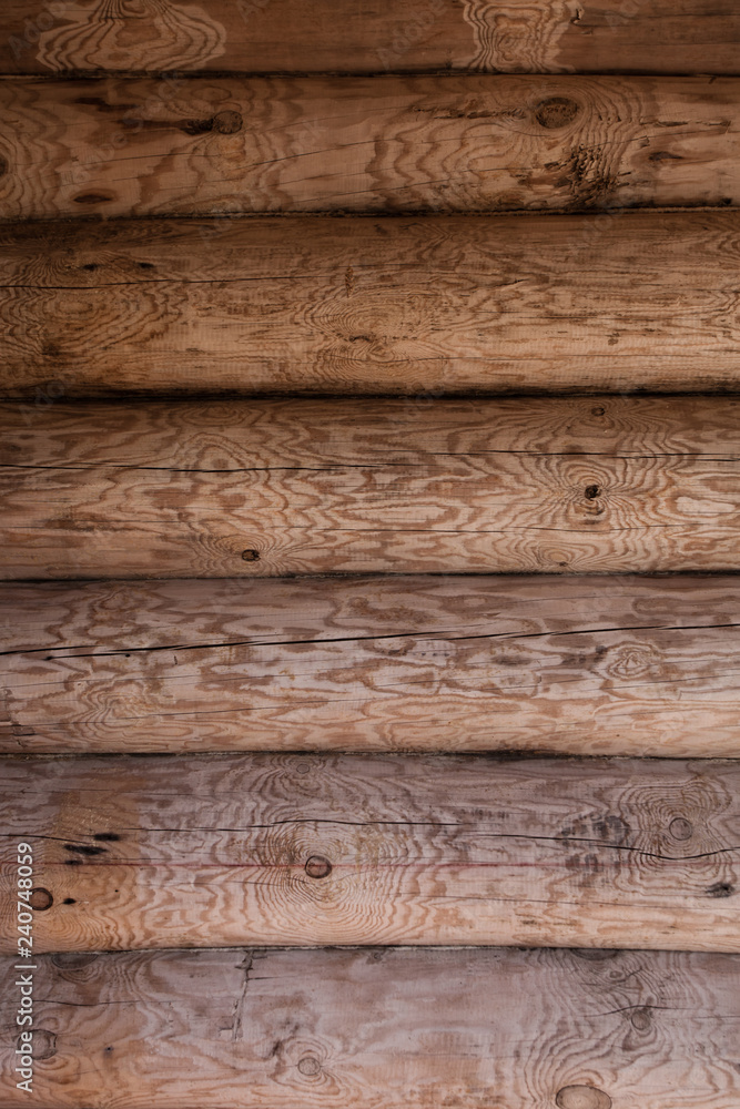 Naklejka premium Wooden rough traditional Wall of logs.