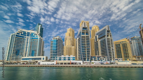 View of Dubai Marina Towers in Dubai at day time timelapse hyperlapse © neiezhmakov