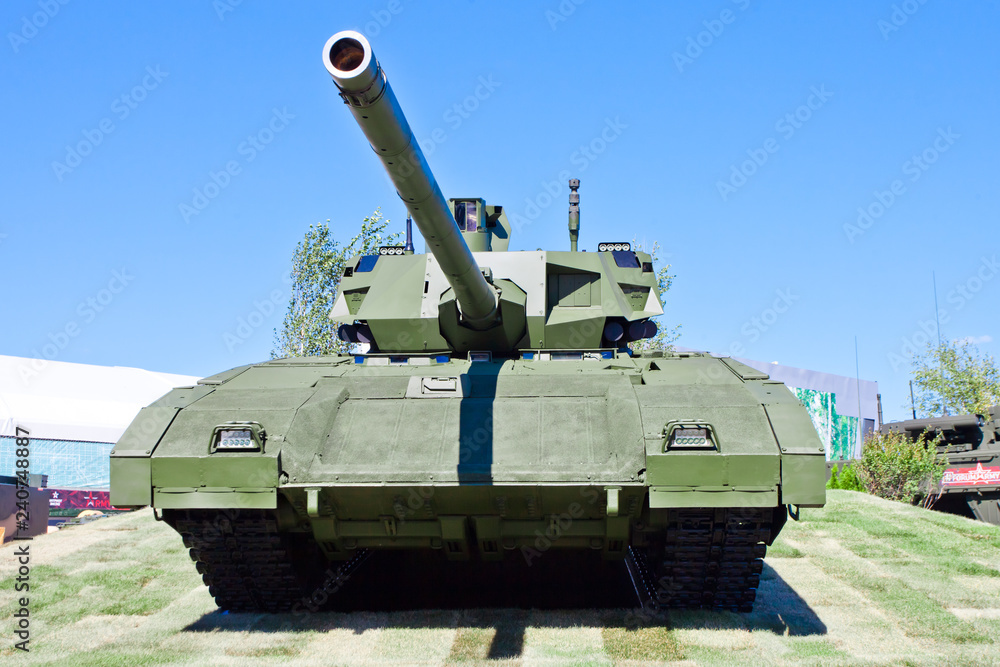 T-14 Armata tank at the military exhibition. Proud tank against the sky. T-14 Armata tank at the military exhibition. Proud tank against the sky.