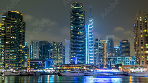 View of Dubai Marina Towers and yahct in Dubai at night timelapse hyperlapse photo