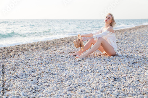 a beautiful woman in a white bathing suit on the Beach Ocean