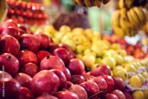 Organic  fresh  red garnet for sale at a local market