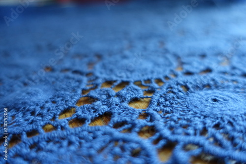 Elements of blue lacy fabric on wood