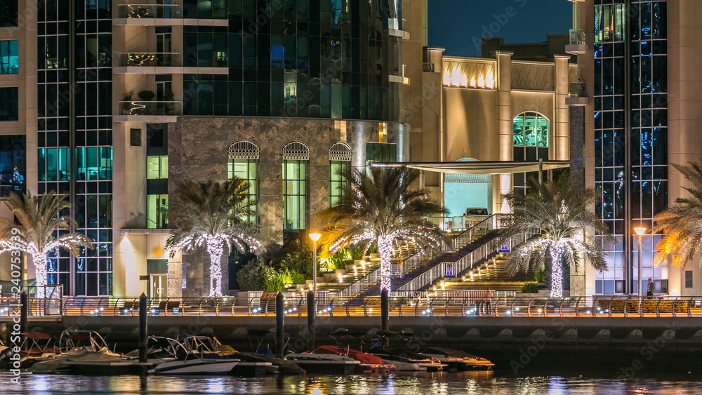 Promenade in Dubai Marina timelapse at night, UAE. Promenade in Dubai Marina timelapse at night, UAE.
