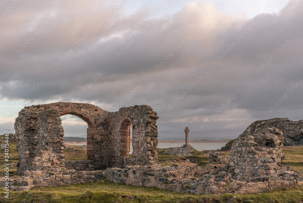 The ruined church and Saxon cross at Ynys Llanddwyn on Anglesey, North Wales.