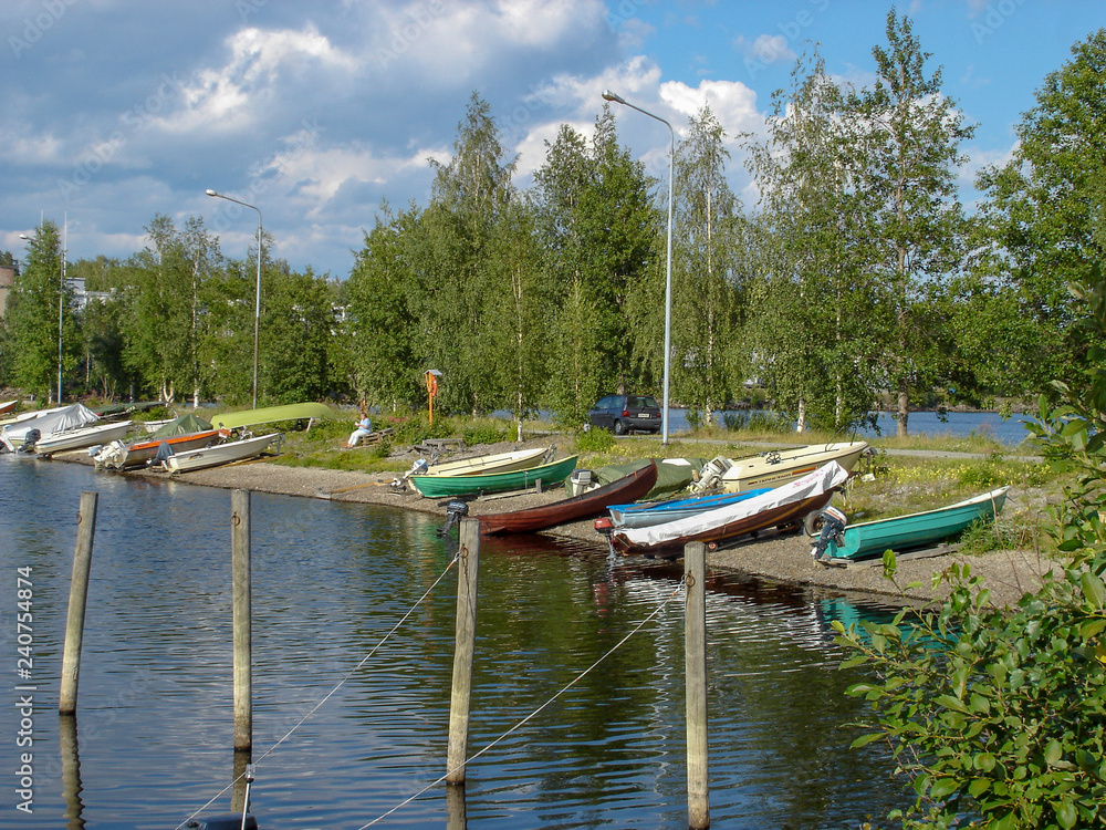 Landscape of the boats parked on the lake at summer Landscape of the boats parked on the lake at summer