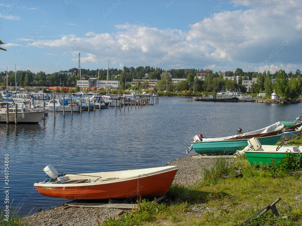 Landscape of the boats parked on the lake at summer Landscape of the boats parked on the lake at summer