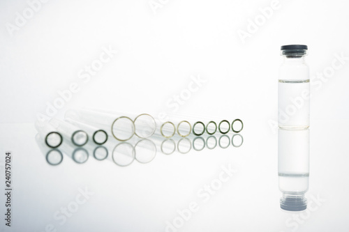 Group of vials with medication on blue methacrylate table. photo