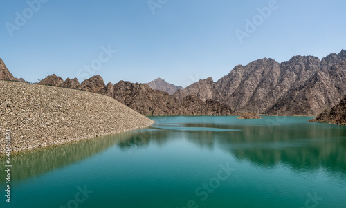 Hatta Dam in Hatta, an enclave of the emirate of Dubai in the Hajar Mountains, United Arab Emirates. photo