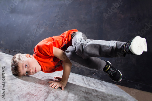 Young russian bboy doing some stunts on the stage