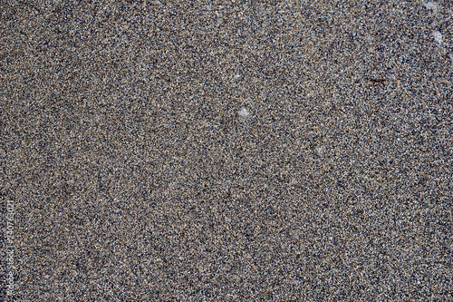 Texture of wet sand backgroud. Grey colours