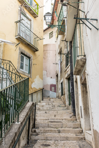 Narrow alleyway and steps in Alfama, Lisbon, Portugal