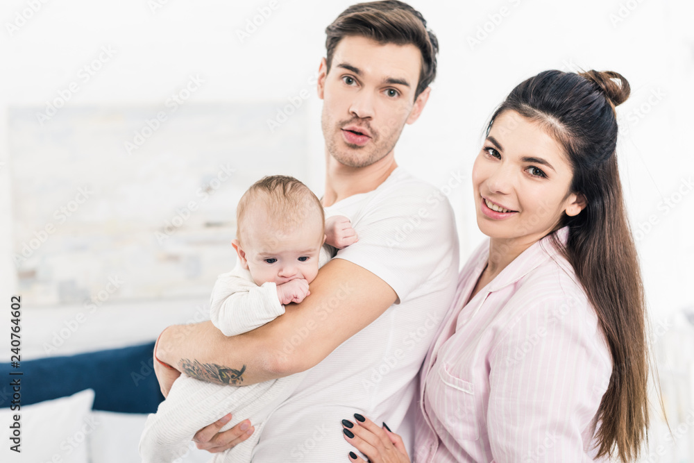portrait of young family with little son at home