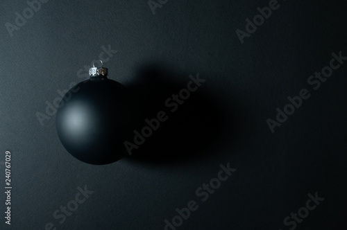 Black Christmas ball on black background