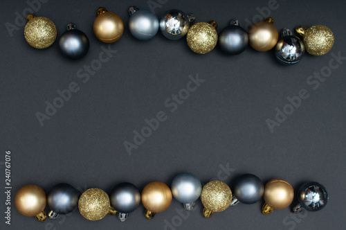 Multiple Christmas silver and gold baubles creative decoration pattern with the black background and copy space