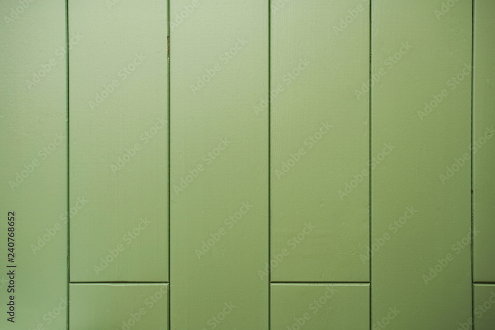 green wooden wall. natural green wood planks background green wooden wall. natural green wood planks background