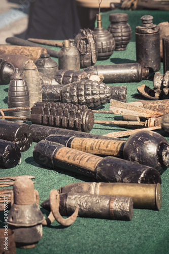 vintage weapons bombs, vertical image of military arms collection