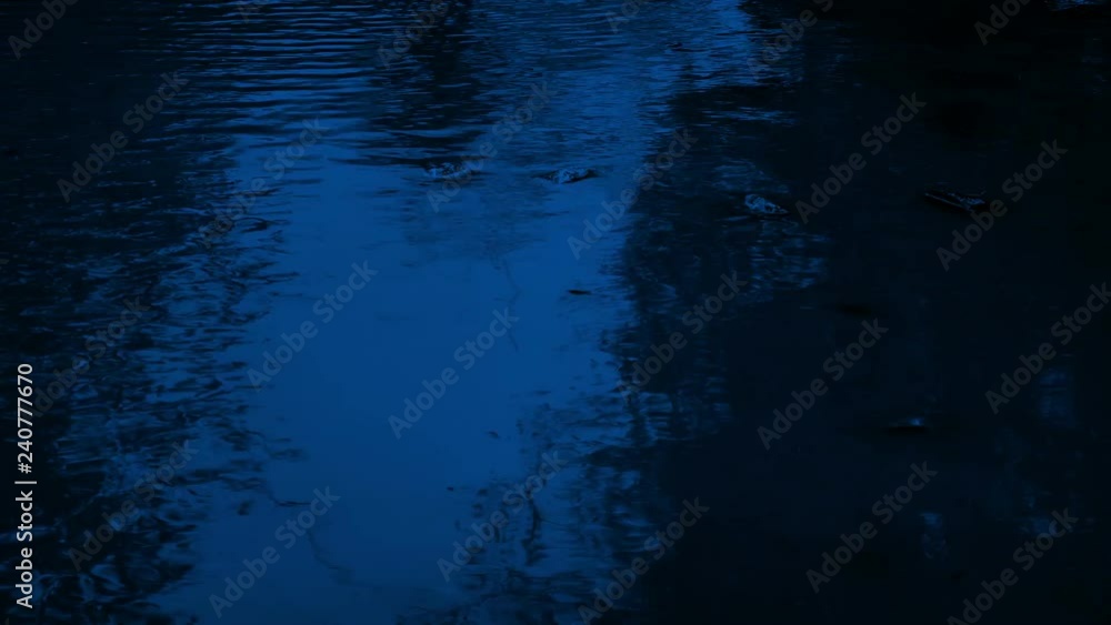 Rippling Pool Of Water At Night Rippling Pool Of Water At Night