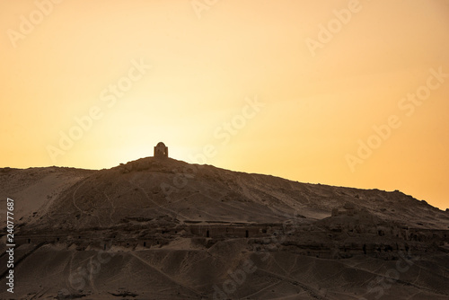 sunset Nile Aswan and the West Bank with Tombs Old Kingdom Qubbet el-Hawa - 'Dome of the Winds' at the crest of the hill photo