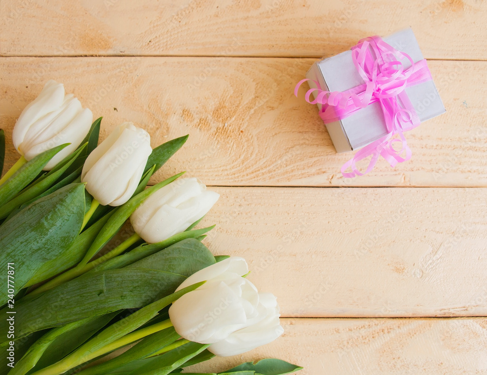 white tulips present on a wooden table white tulips present on a wooden table