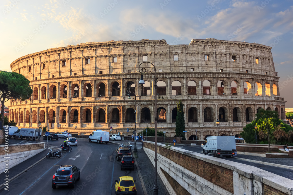 Coliseum in Rome and a street nearby, Italy, sunrise view