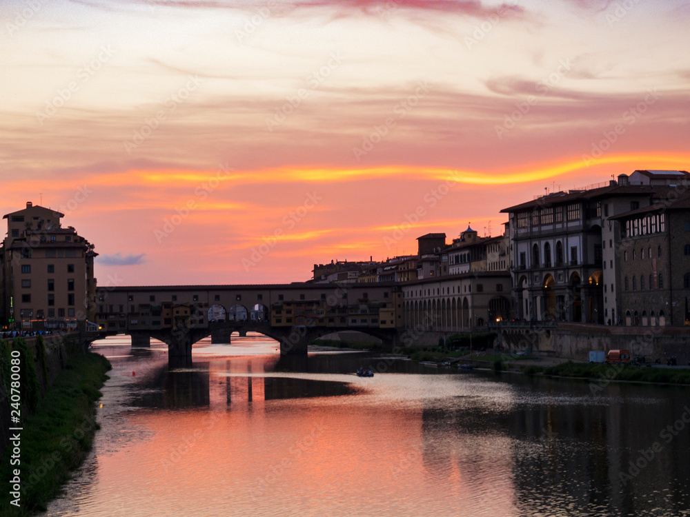 Beautiful summer sunset over Arno River and Ponte Vecchio in Florence, Italy