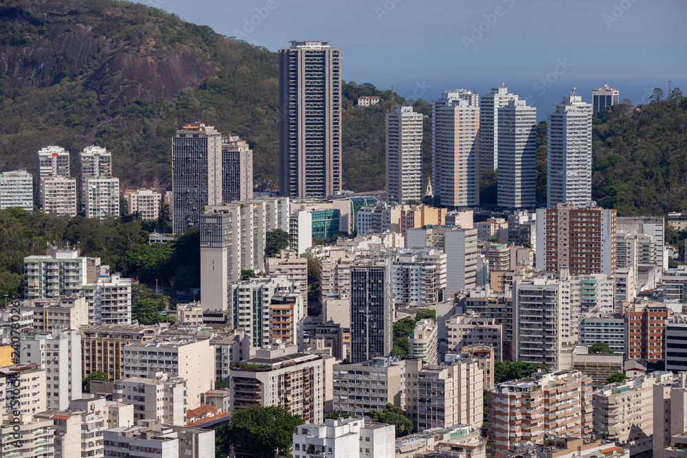 Urban view of many tall buildings in Rio de Janeiro with the natural surrounding in the background