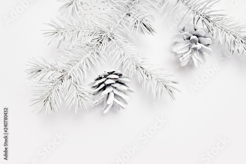Mockup Christmas white tree and cone. Flat lay on a white wooden background, with place for your text. Top view