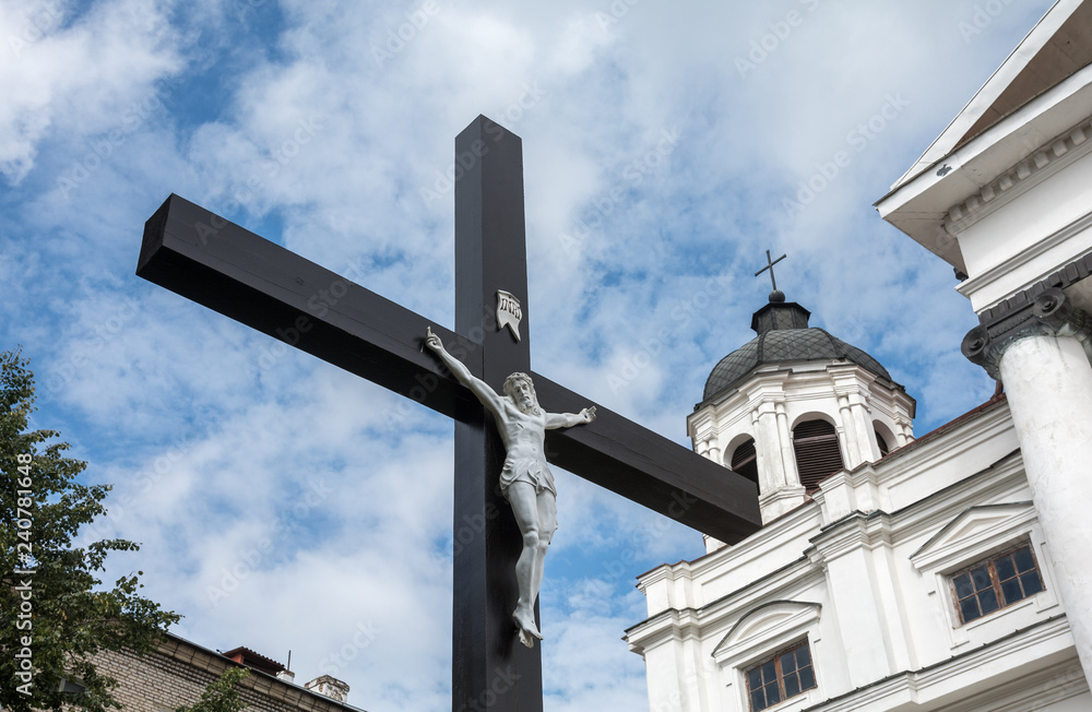 Cross with the crucifixion of Jesus near the Catholic Cathedral of the Assumption of the Virgin Mary and St. Stanislav in Mogilev. Belarus
