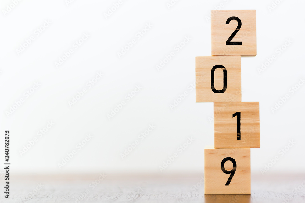 New year 2019 on wooden cubes on table with copy space for text New year 2019 on wooden cubes on table with copy space for text
