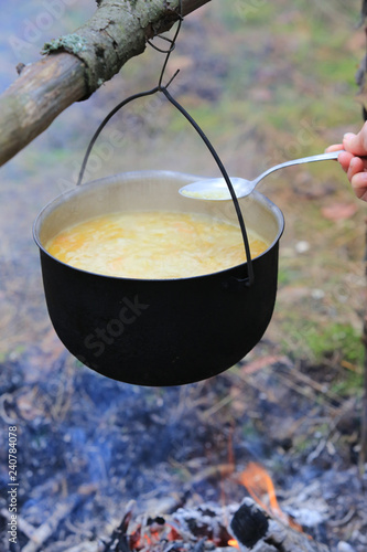 cooking in tourist kettle over campfire