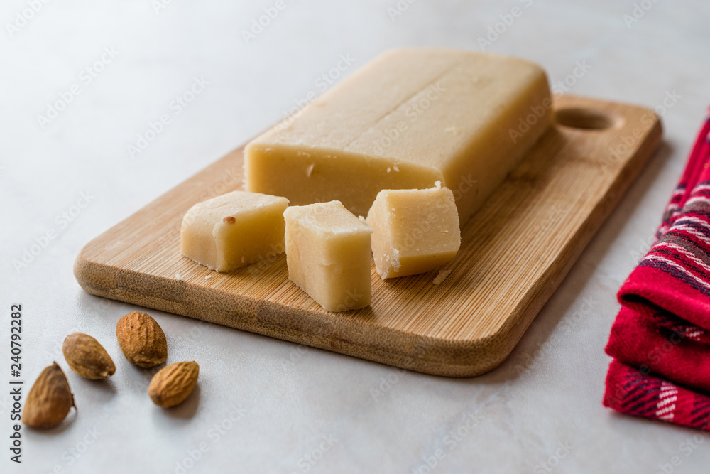 Homemade Almond Paste Whole Marzipan on Wooden Board. Homemade Almond Paste Whole Marzipan on Wooden Board.