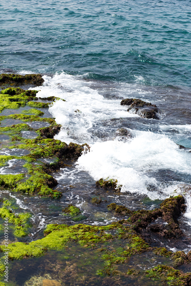 waves crashing on rocks