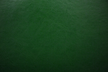 Green textured leather background. Abstract leather texture.