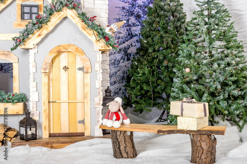 New Year's house with deer and trees, a winter house in the forest, a fairy tale, miracles, sledges.