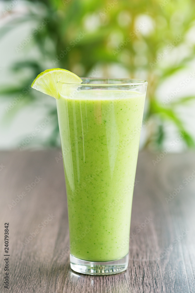 Green fresh smoothie with avocado and banana in glass, healthy lifestyle, vegan nutrition, Green fresh smoothie with avocado and banana in glass, healthy lifestyle, vegan nutrition,