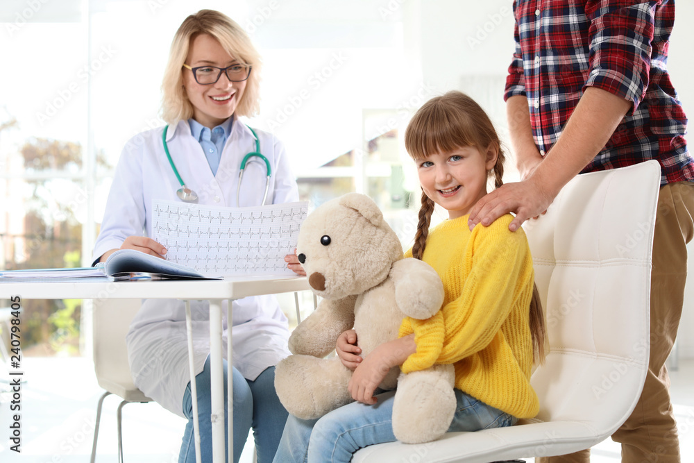 Little girl with father visiting children's doctor in hospital Little girl with father visiting children's doctor in hospital