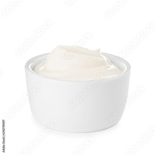 Bowl with sour cream on white background