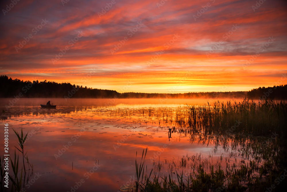 Summer sunrise over lake in Poland