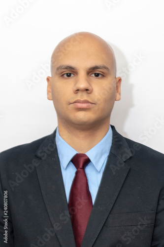 Bald man in suit and tie