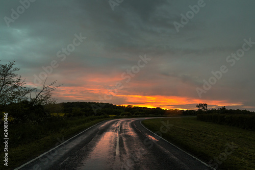 Wet Road Bend At Sunset