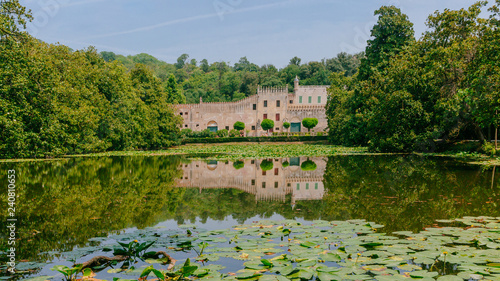 Castello del Catajo, a Venetian patrician house, and its reflectiton in the pond of its garden, near Padua, Italy