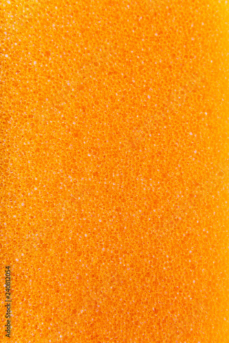 Orange background texture of the foam. Orange foam.