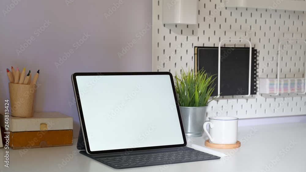 Stylish minimal workplace with mockup tablet and copy space Stylish minimal workplace with mockup tablet and copy space