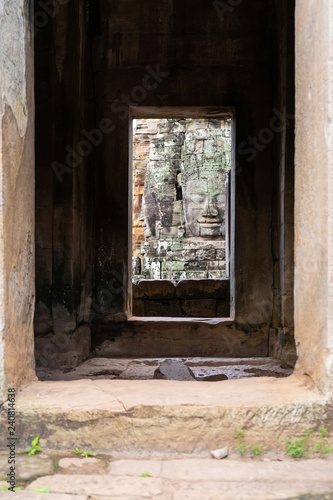 smiling stone face on tower at Bayon castle