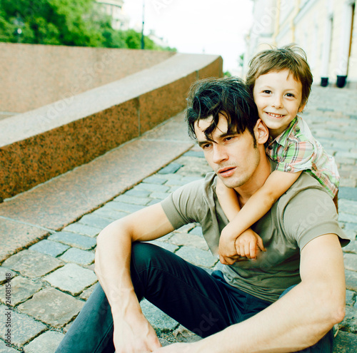 little son with father in city happy hugging close up smiling photo